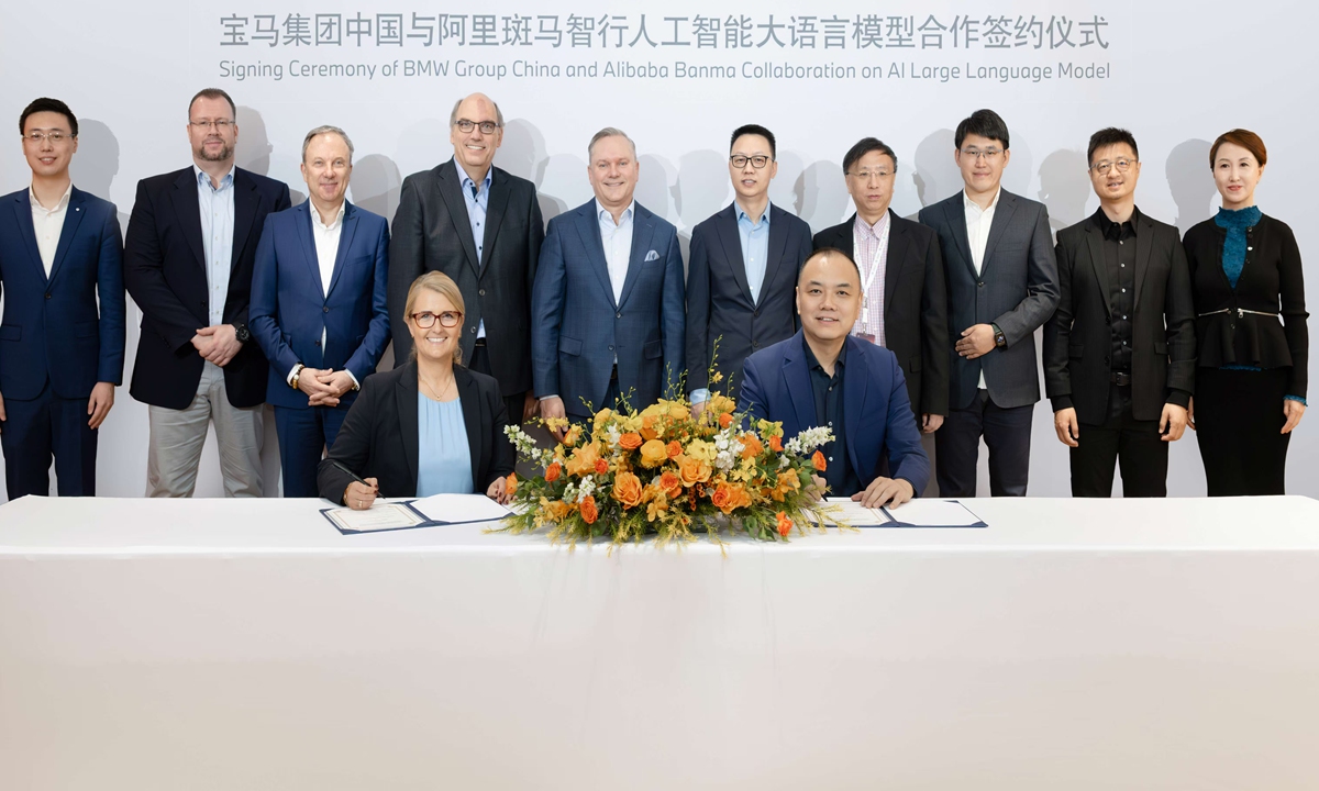 A signing ceremony between BMW and Alibaba to deepen their strategic partnership is held in Beijing on March 26, 2025.